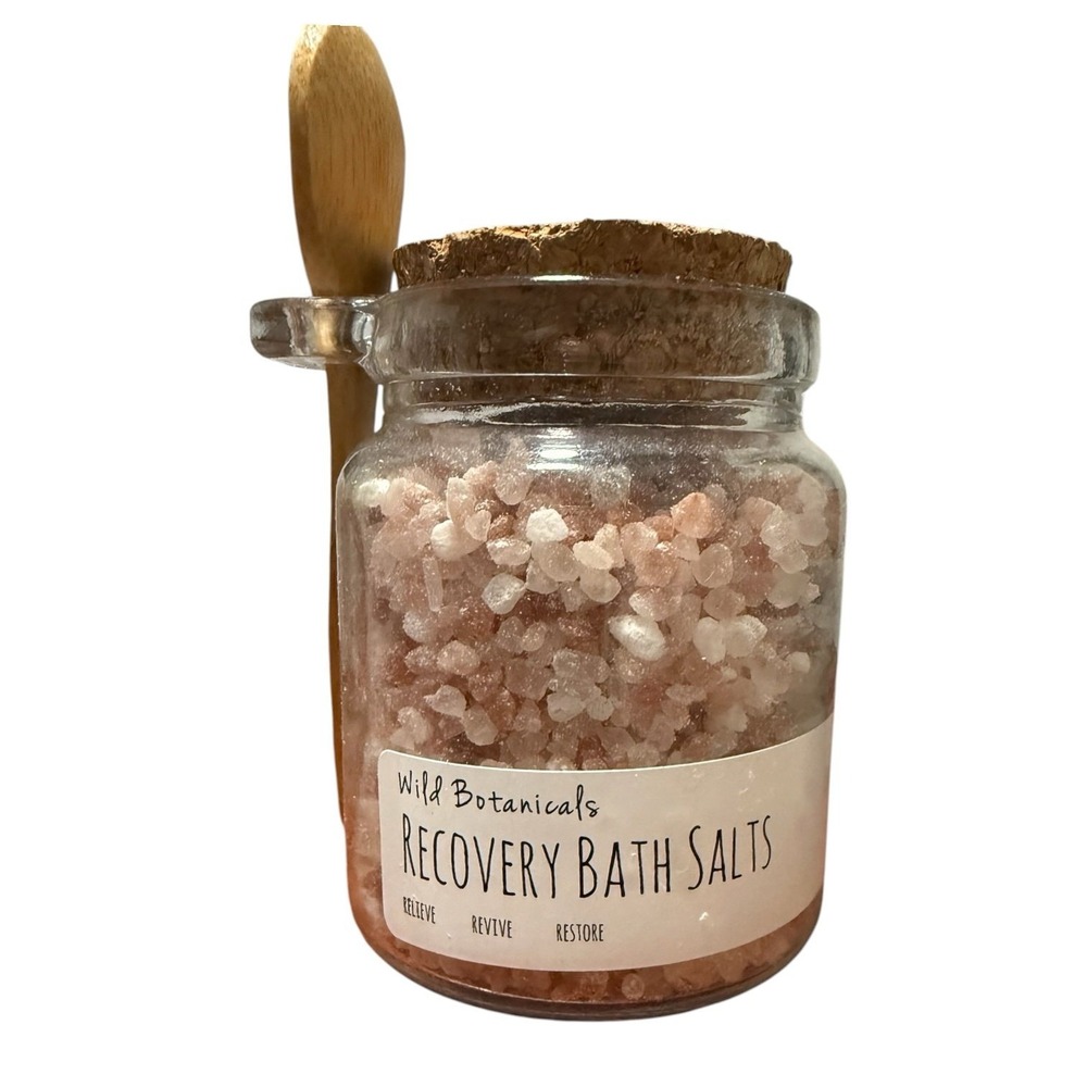Wild Botanicals Recovery Bath Salts 10 oz glass jar with wooden spoon